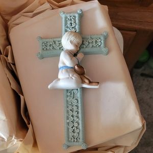 Cross with boy praying
